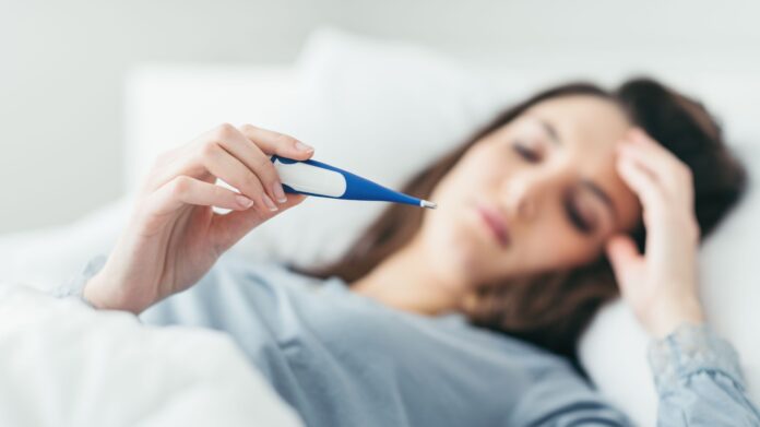 woman-measuring-her-temperature-royalty-free-image-1570478654