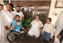 Energy Minister Anil Vij congratulates Shahpur shooter Deepak Saini for winning gold at the Shooting World Cup